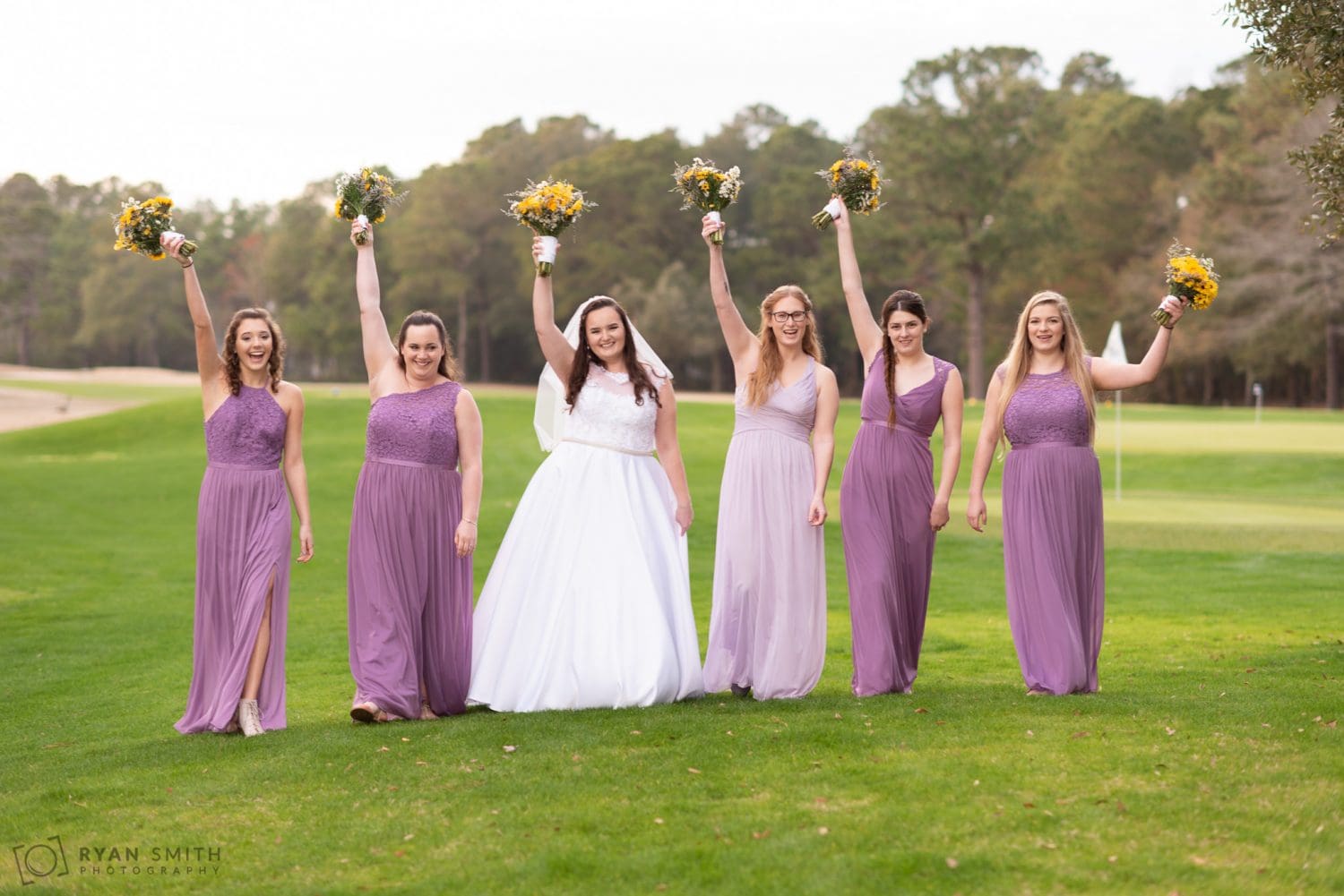 Bridesmaids holding flower in the air Litchfield Country Club