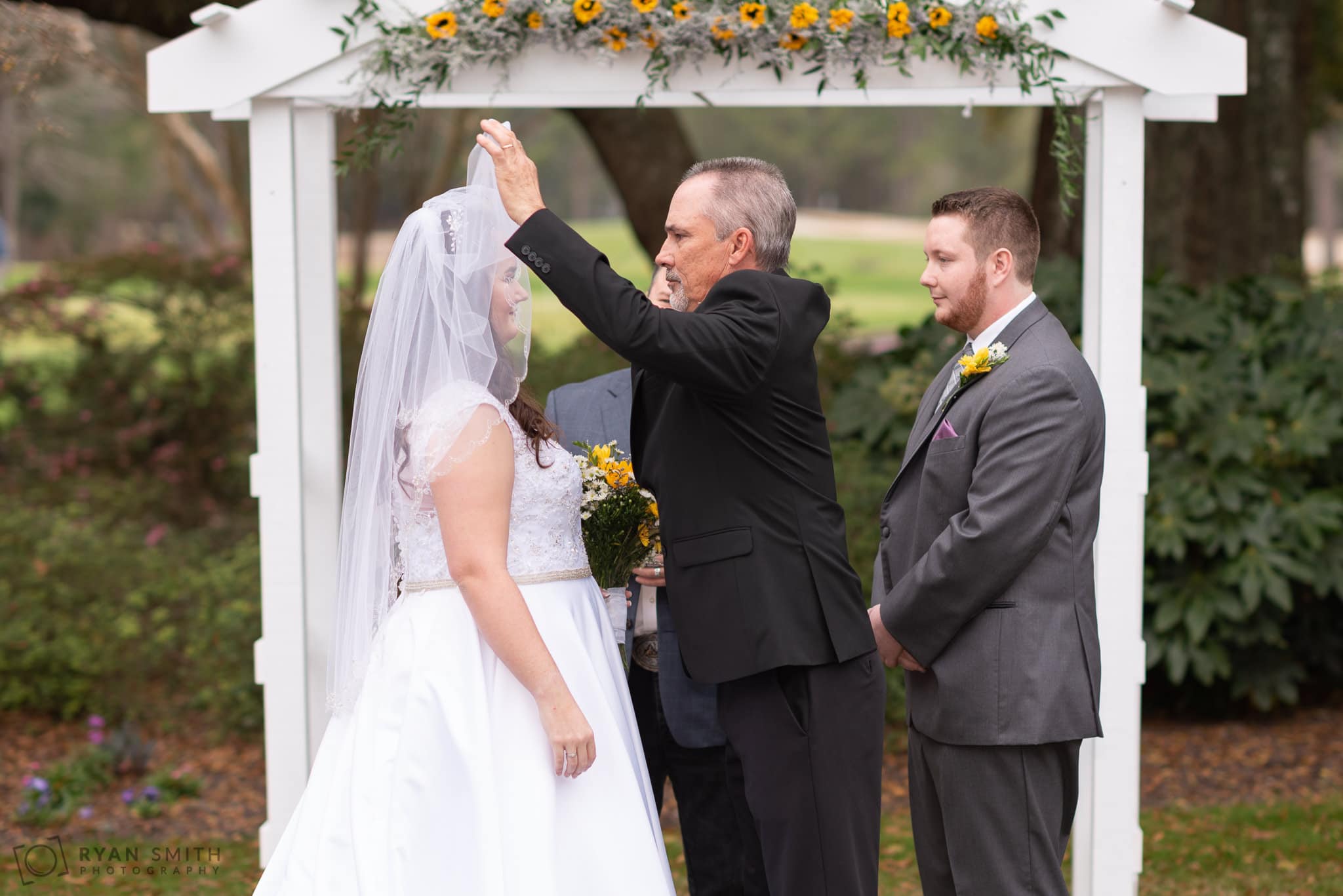 Father lifting the veil off the bride Litchfield Country Club