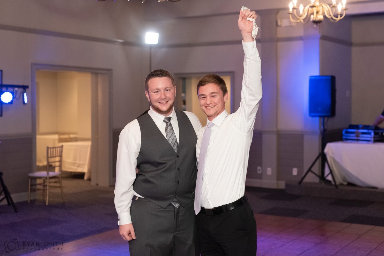 Groom with single guy who caught the garter  Litchfield Country Club