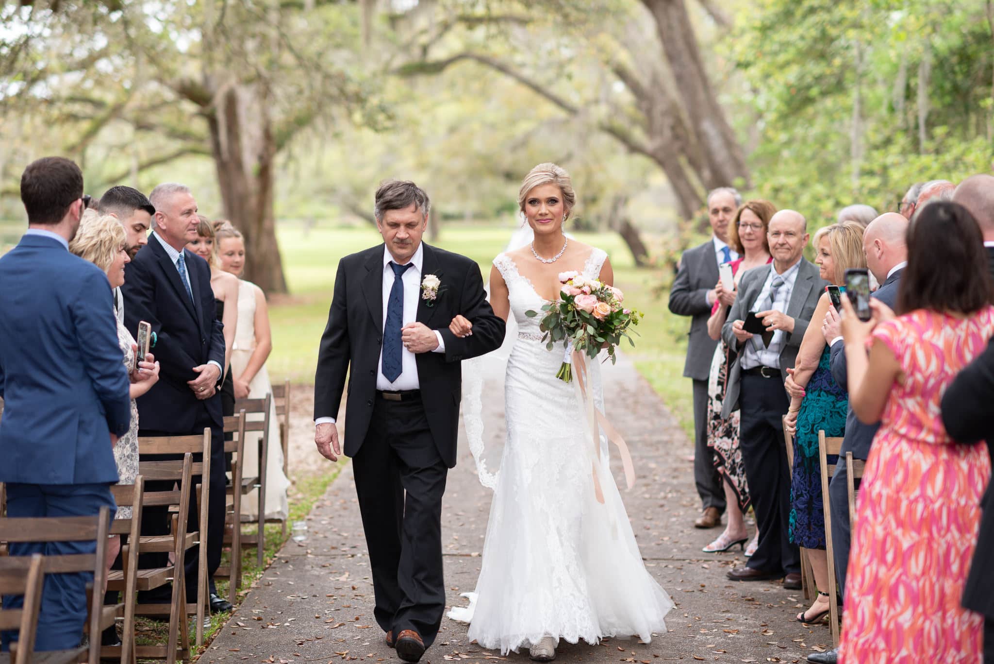 Bride and father walking down the isle - Brookgreen Gardens