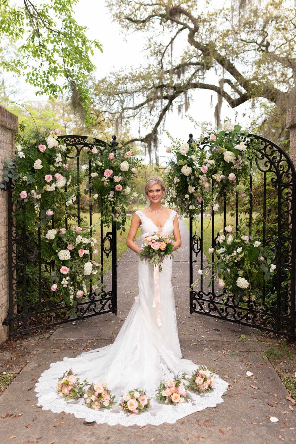Bride posing in front of the gates - Brookgreen Gardens