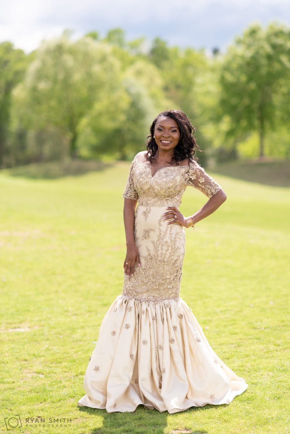 Bride posing in African wedding dress River Ridge Golf Club