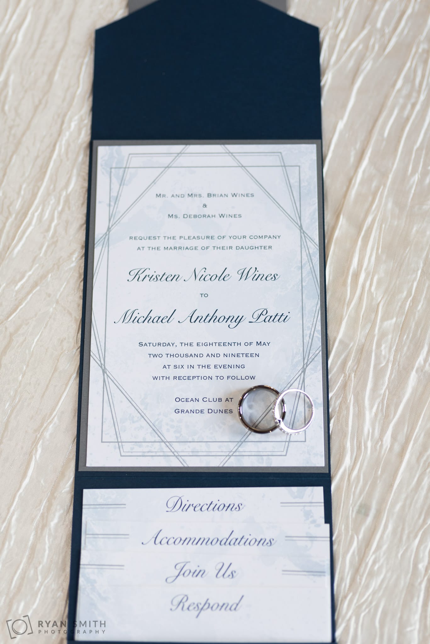 Detail shot of invitation with rings Grande Dunes Ocean Club