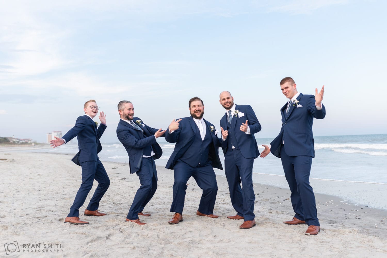 Groomsmen striking a pose Grande Dunes Ocean Club