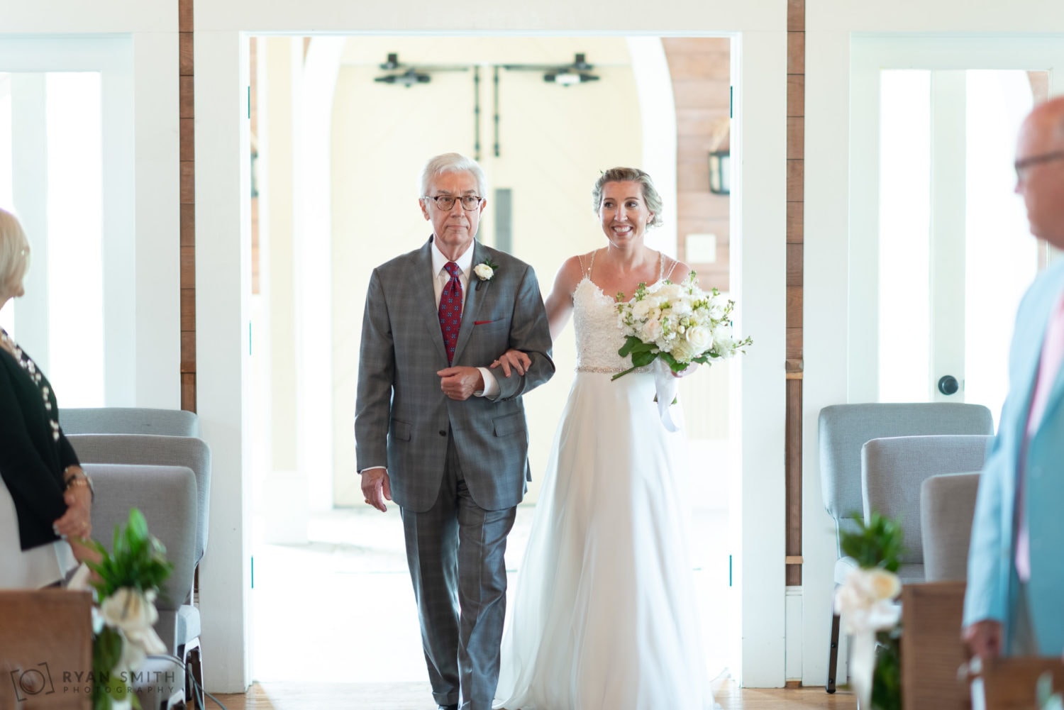 Bride and father walking down the isle Pawleys Island Community Chapel