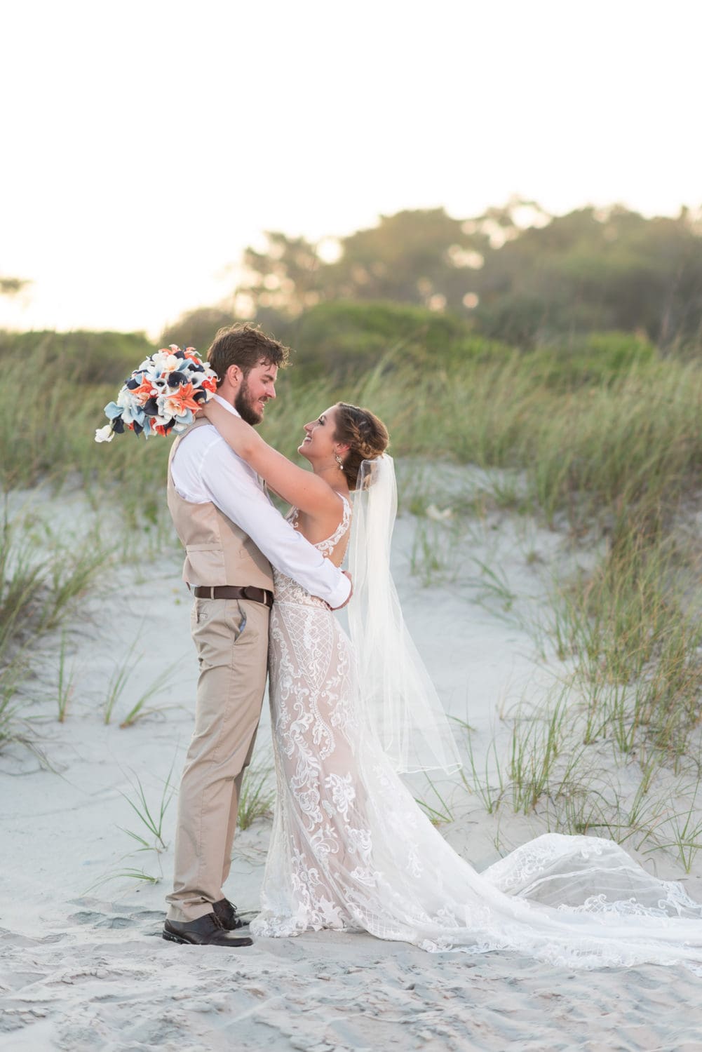 Bride and groom standing by the dunes Grande Dunes Ocean Club - Myrtle Beach