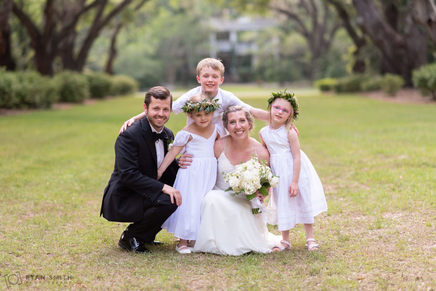 Bride and groom with the kids Wachesaw Plantation