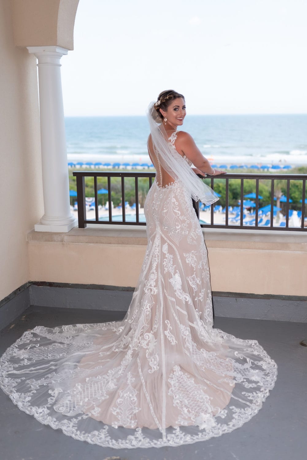 Bride standing on the balcony Grande Dunes Ocean Club - Myrtle Beach