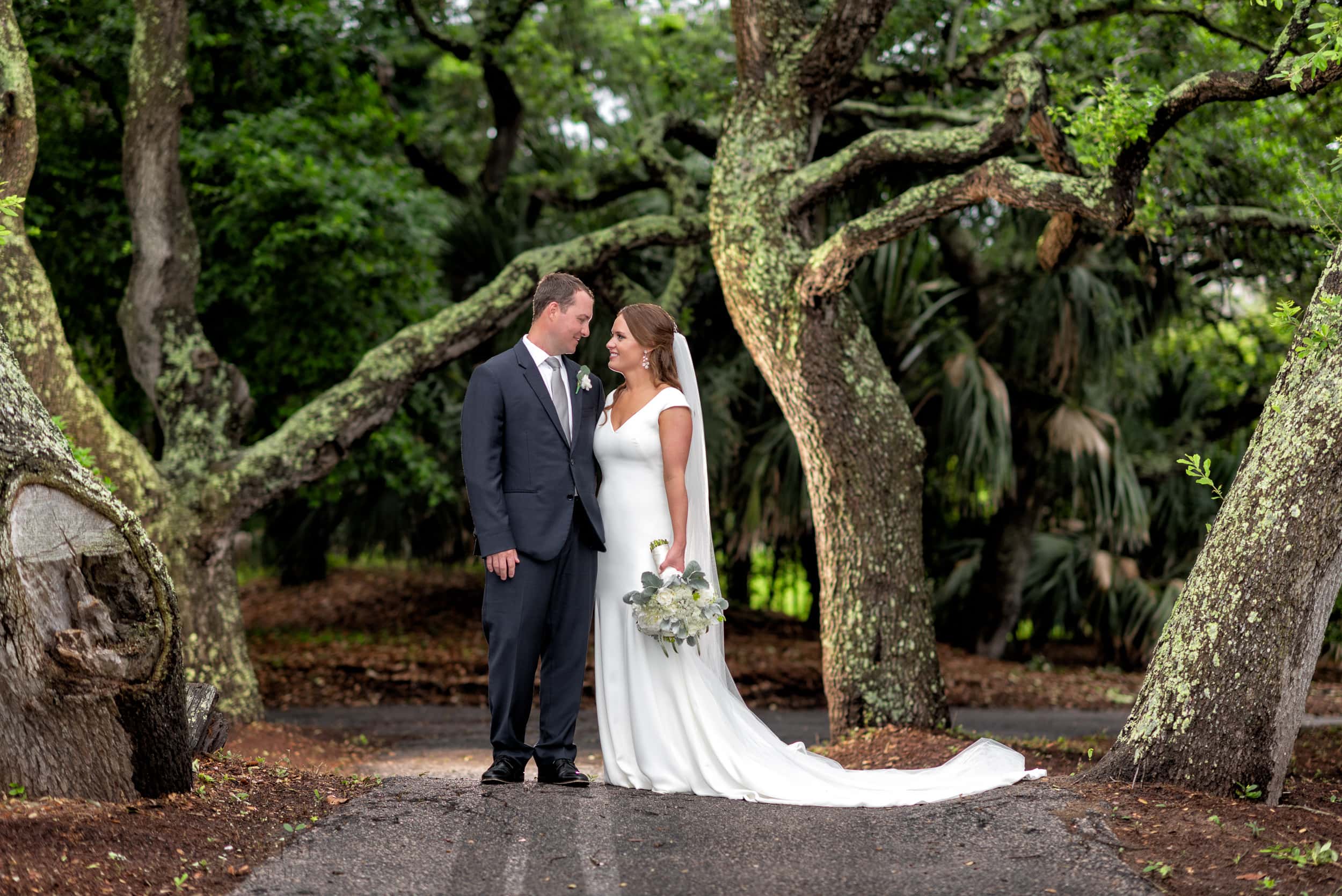 Couple standing under the old oaks - Dunes Golf and Beach Club
