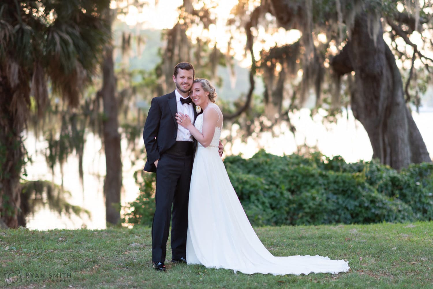 Embrace by the Waccamaw River and oak trees Wachesaw Plantation