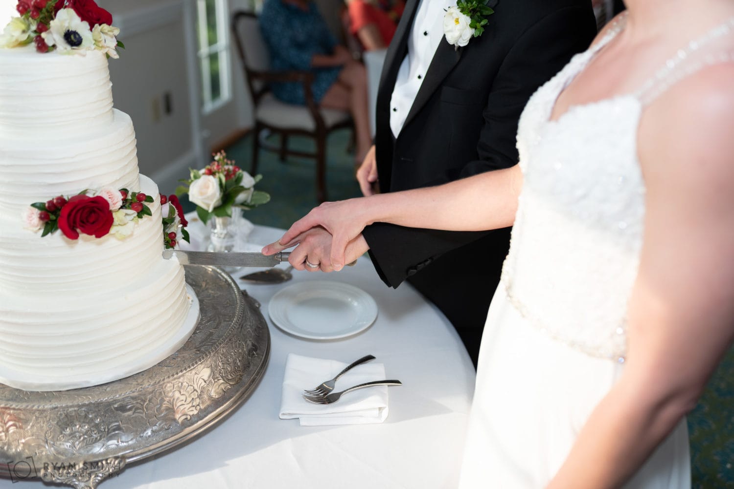 Holding hands cutting the cake Wachesaw Plantation
