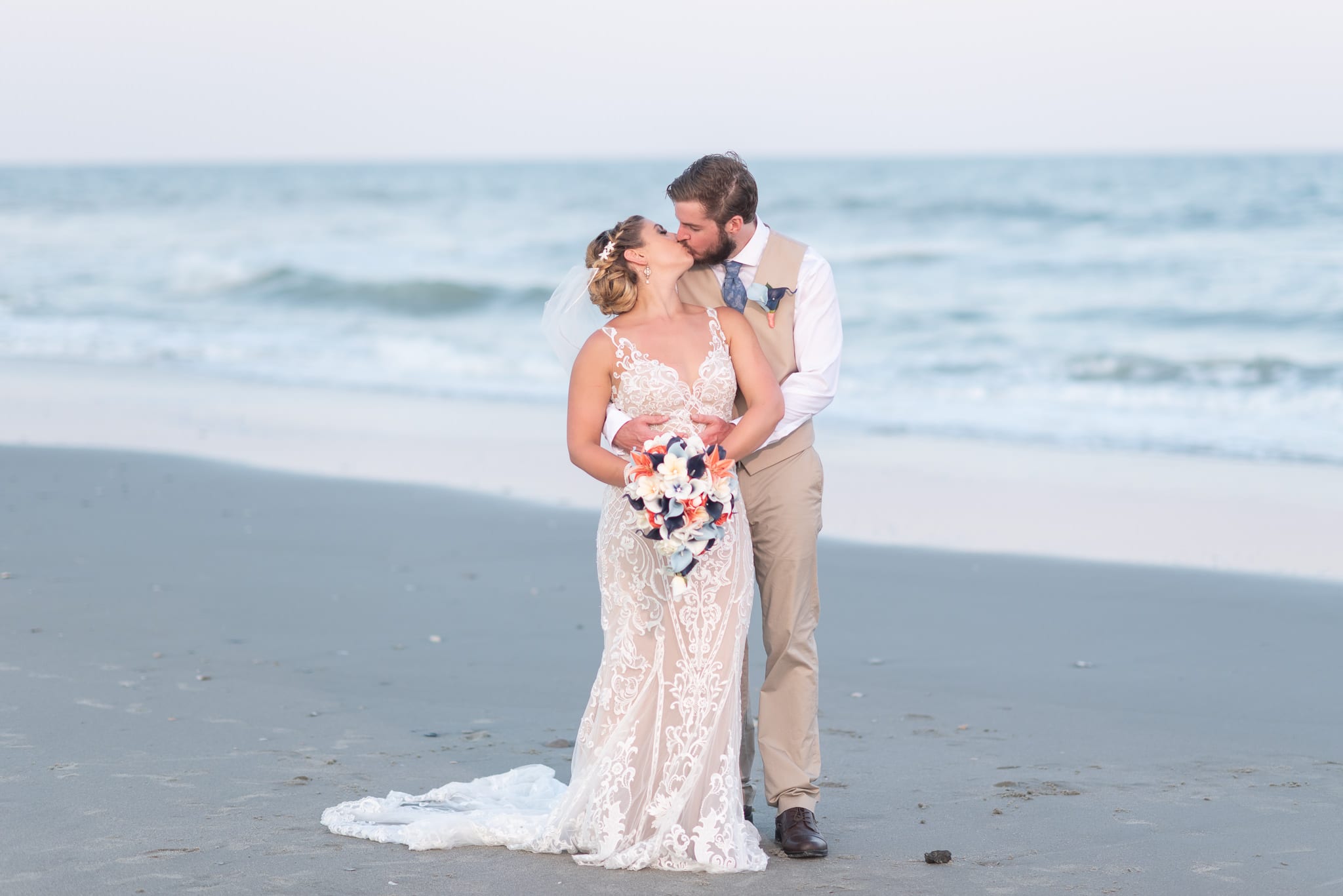 Looking back at groom for a kiss Grande Dunes Ocean Club - Myrtle Beach