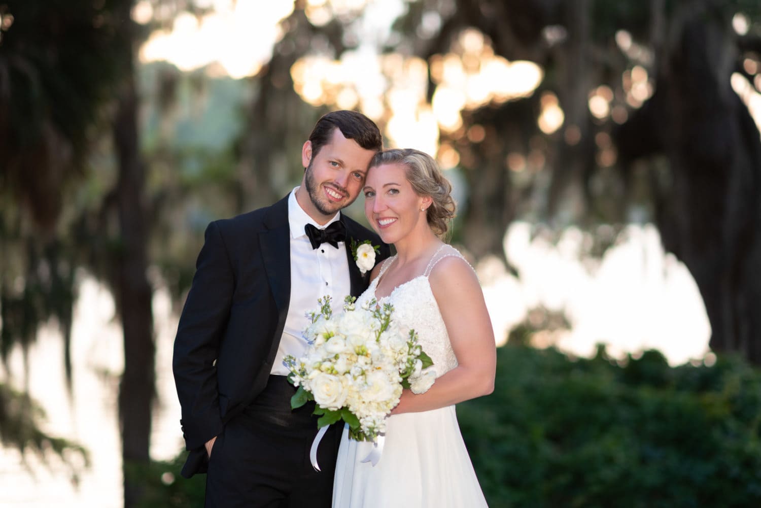 Portrait of bride and groom in the sunset on the Waccamaw River Wachesaw Plantation