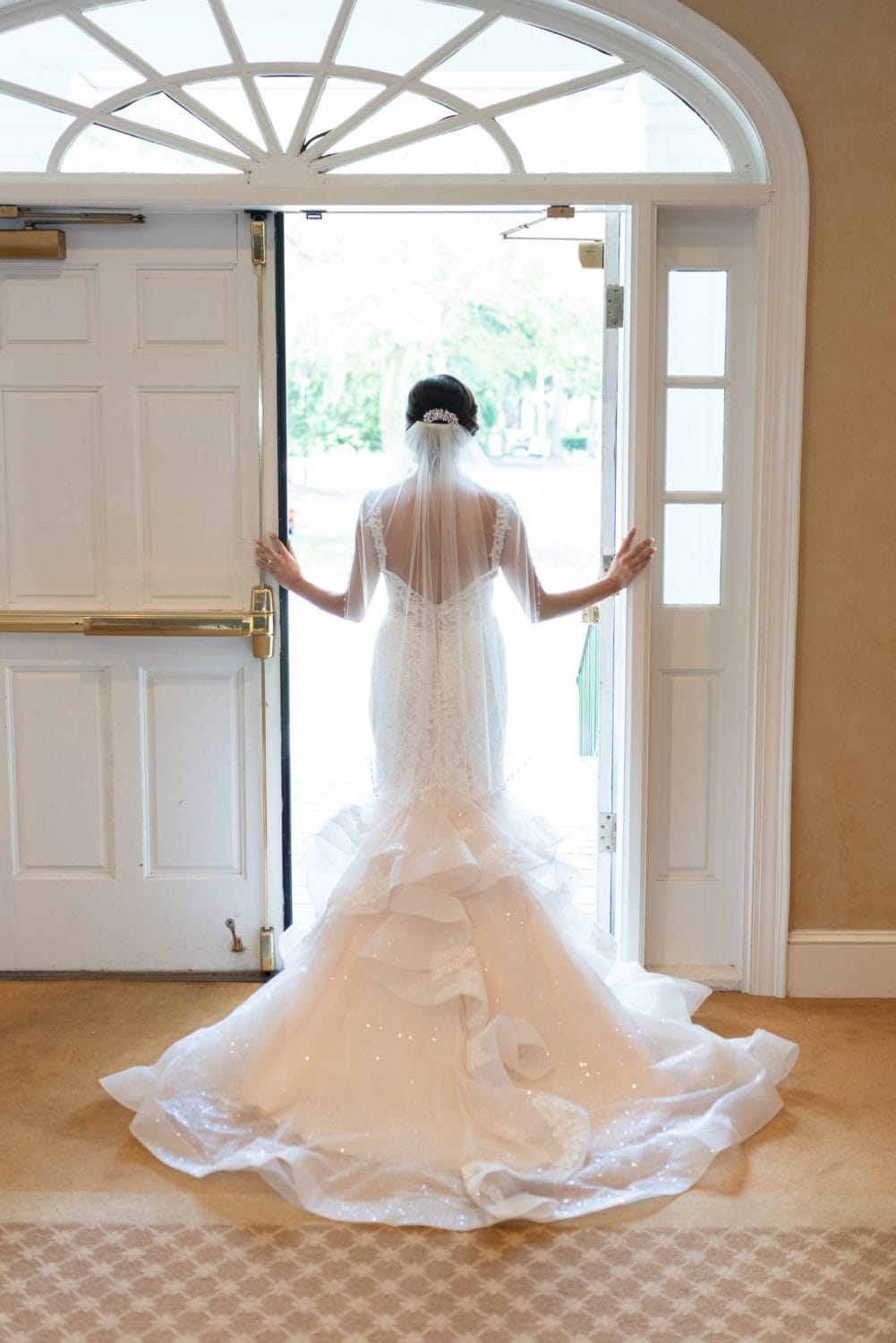 Bride standing in doorway light Pawleys Plantation
