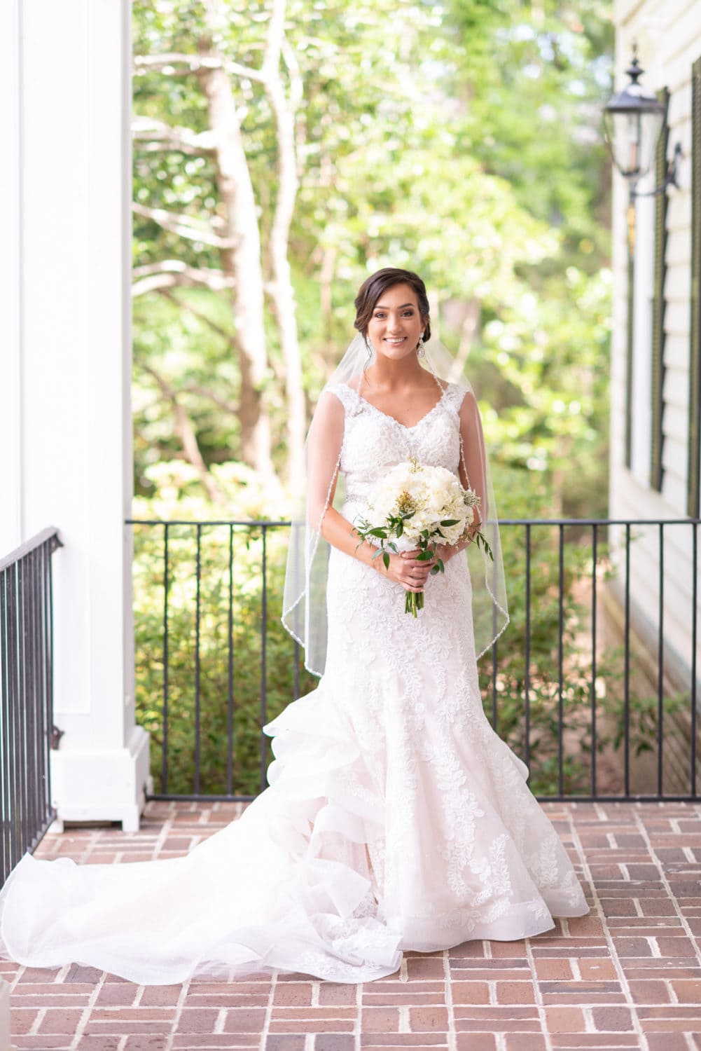 Portraits of bride on the patio beside the clubhouse Pawleys Plantation