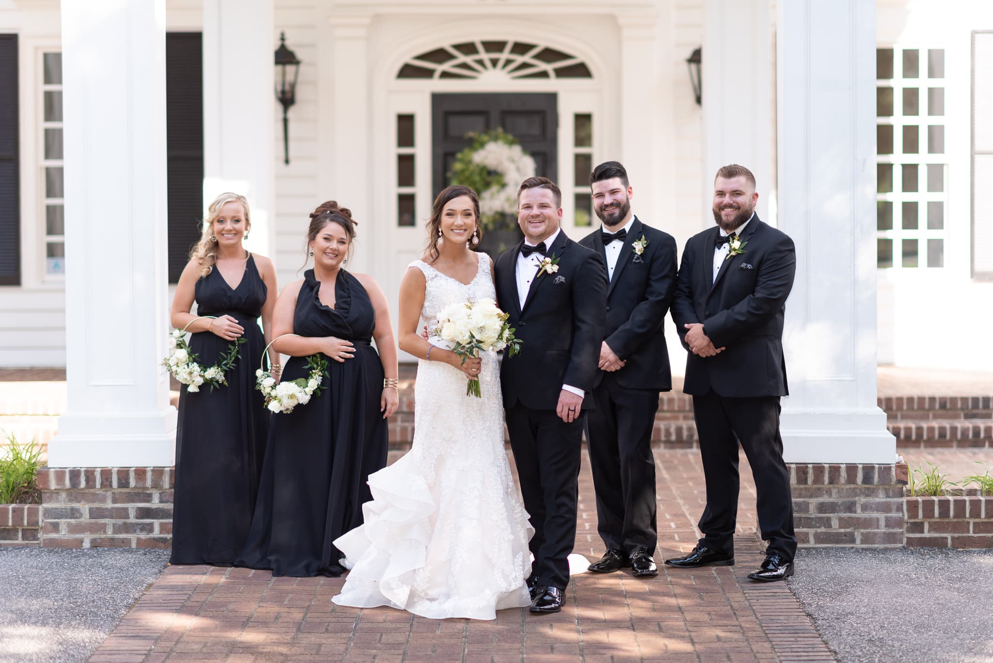Wedding party in front of the clubhouse doors Pawleys Plantation