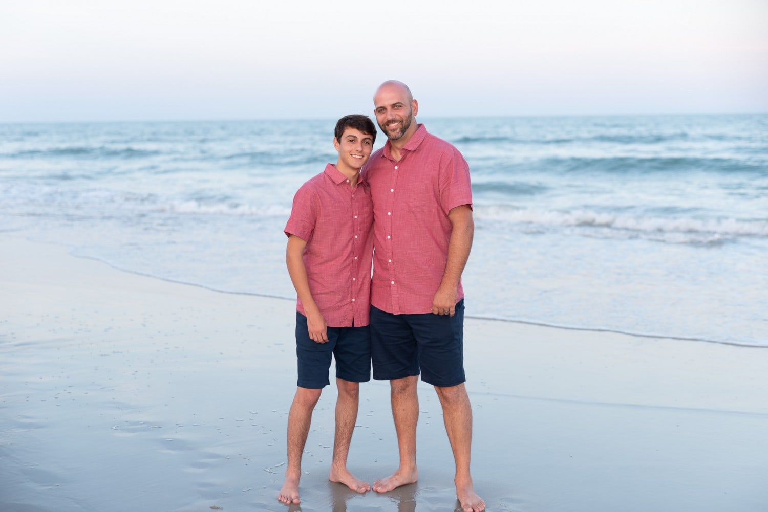 Father and son standing in front of the ocean - Huntington Beach State Park