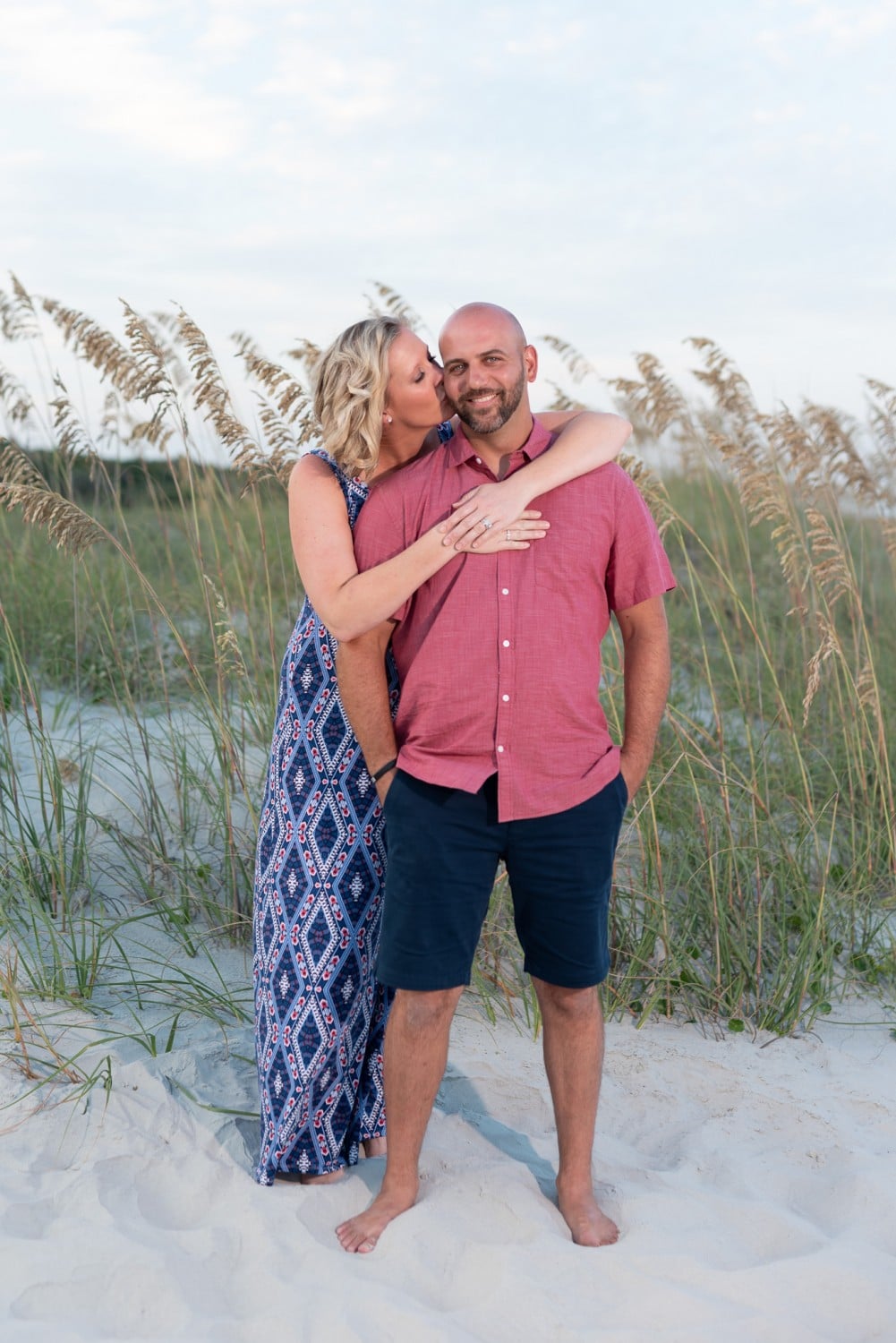 Kiss on the cheek in front of the sea oats - Huntington Beach State Park