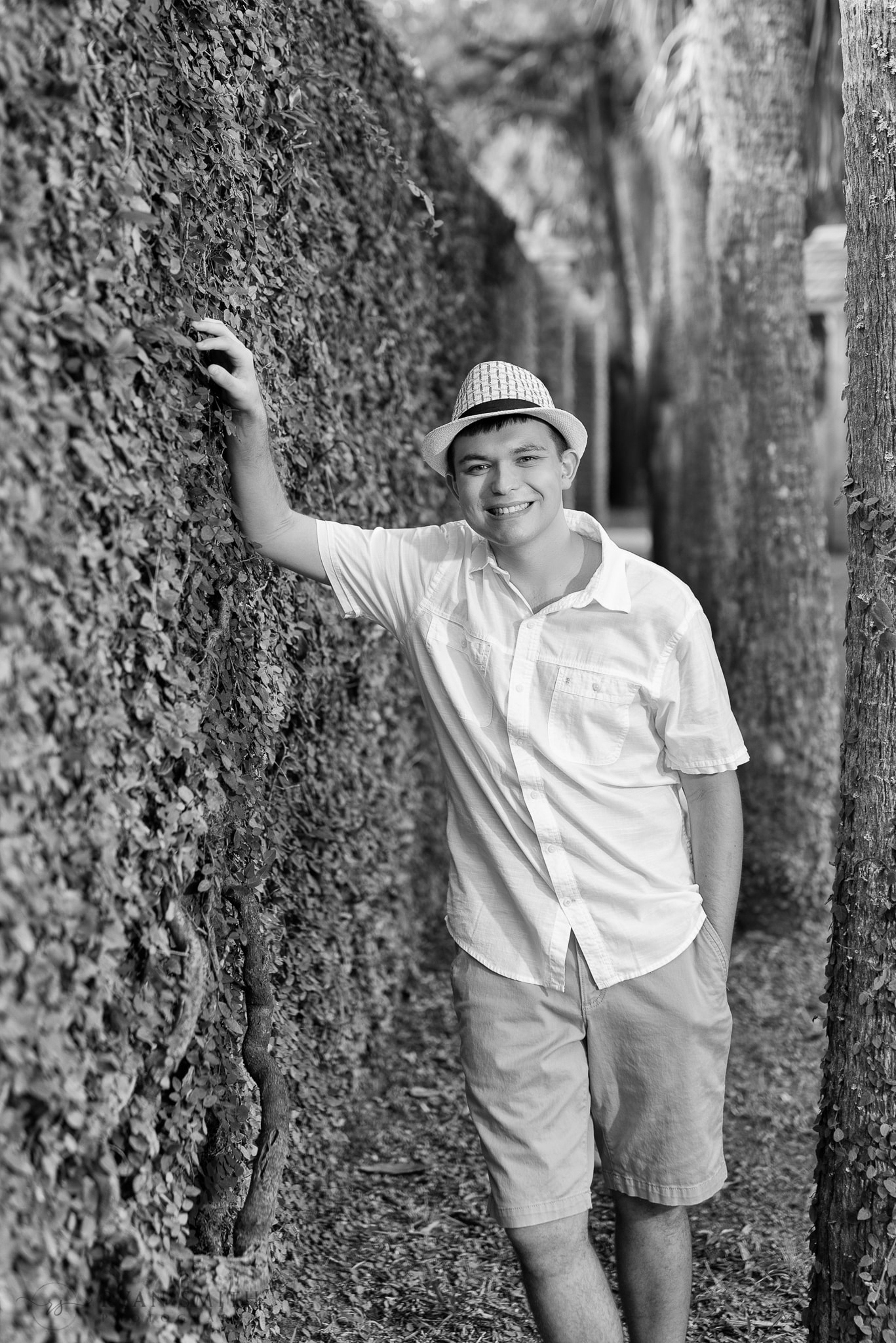 Leaning against the castle wall in black and white - Huntington Beach State Park
