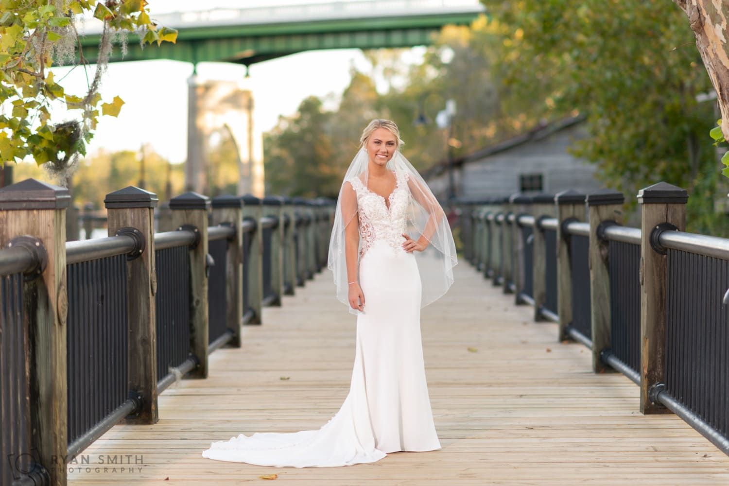Bride posing on the river walk boardwalk - Conway River Walk