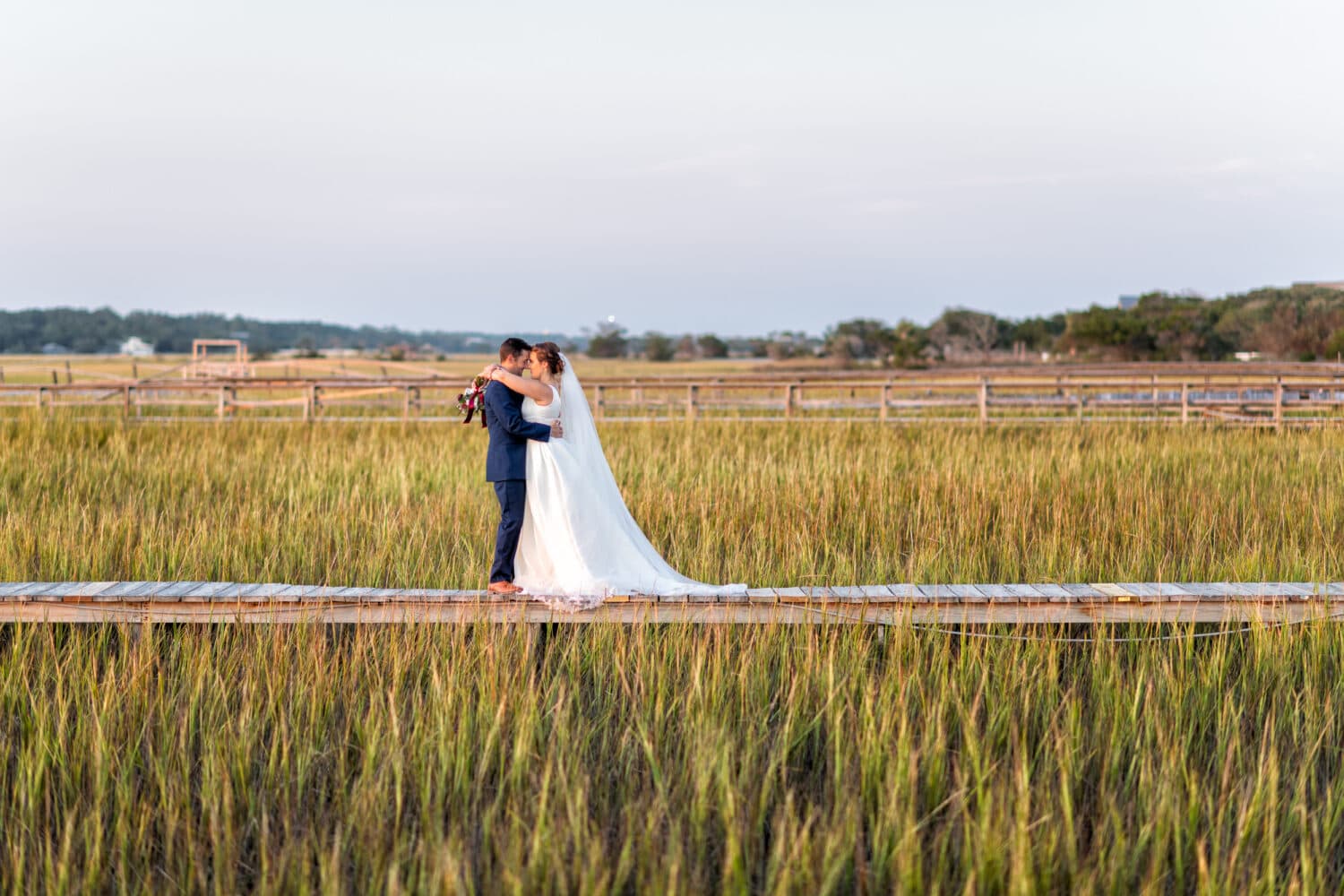 Bride and groom on the marsh boardwalk - Pelican Inn - Pawleys Island