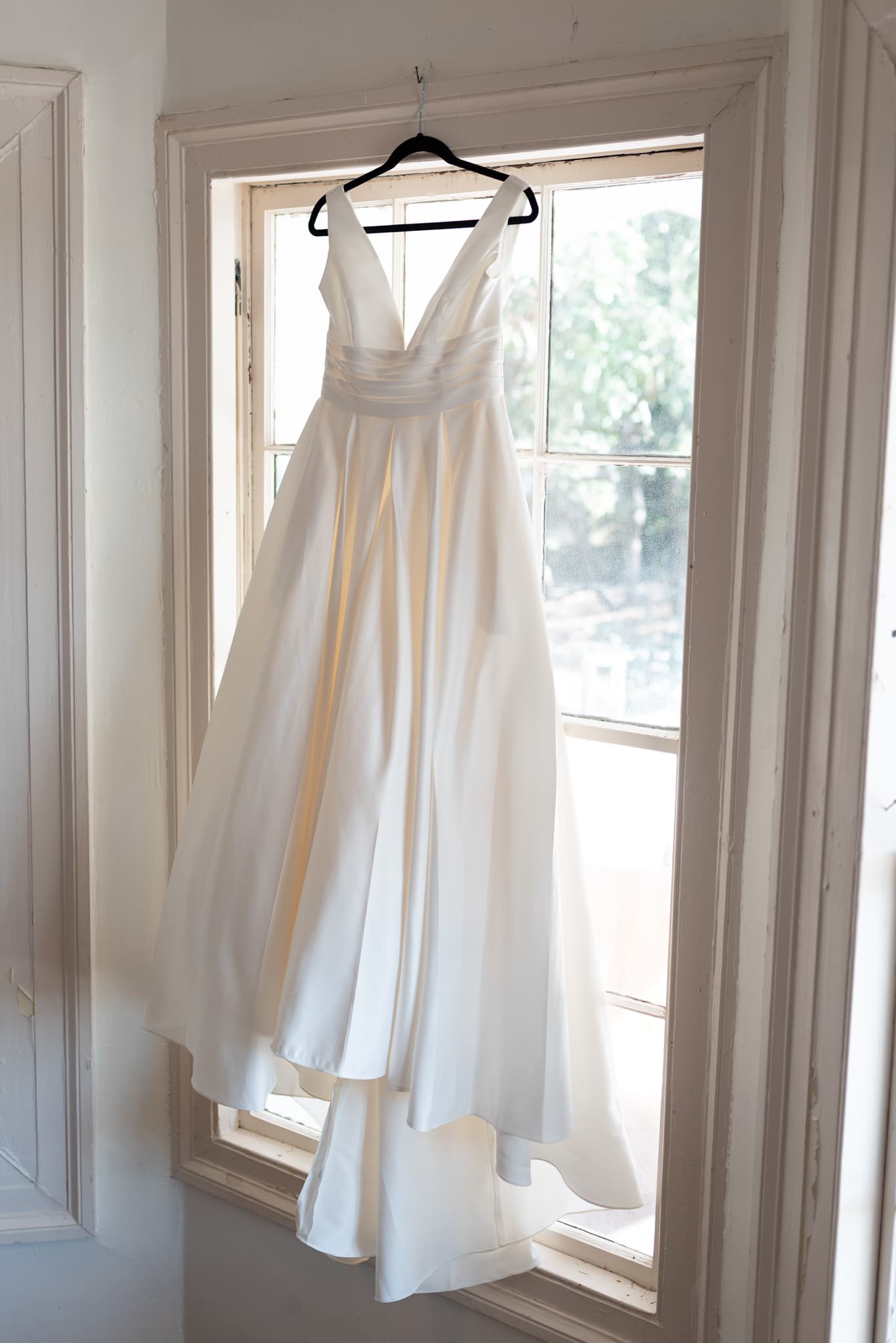 Bride's dress hanging in the window - Pelican Inn - Pawleys Island