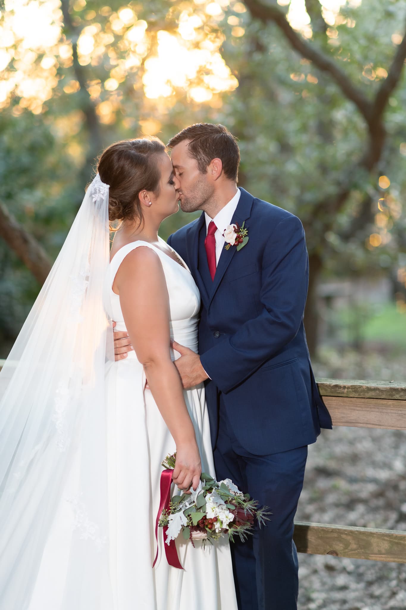 Kiss with sunlight coming through the trees - Pelican Inn - Pawleys Island