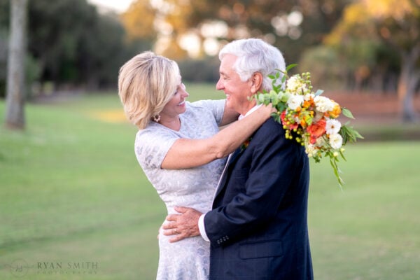 Happy older just married couple on the golf course - Dunes Golf and Beach Club