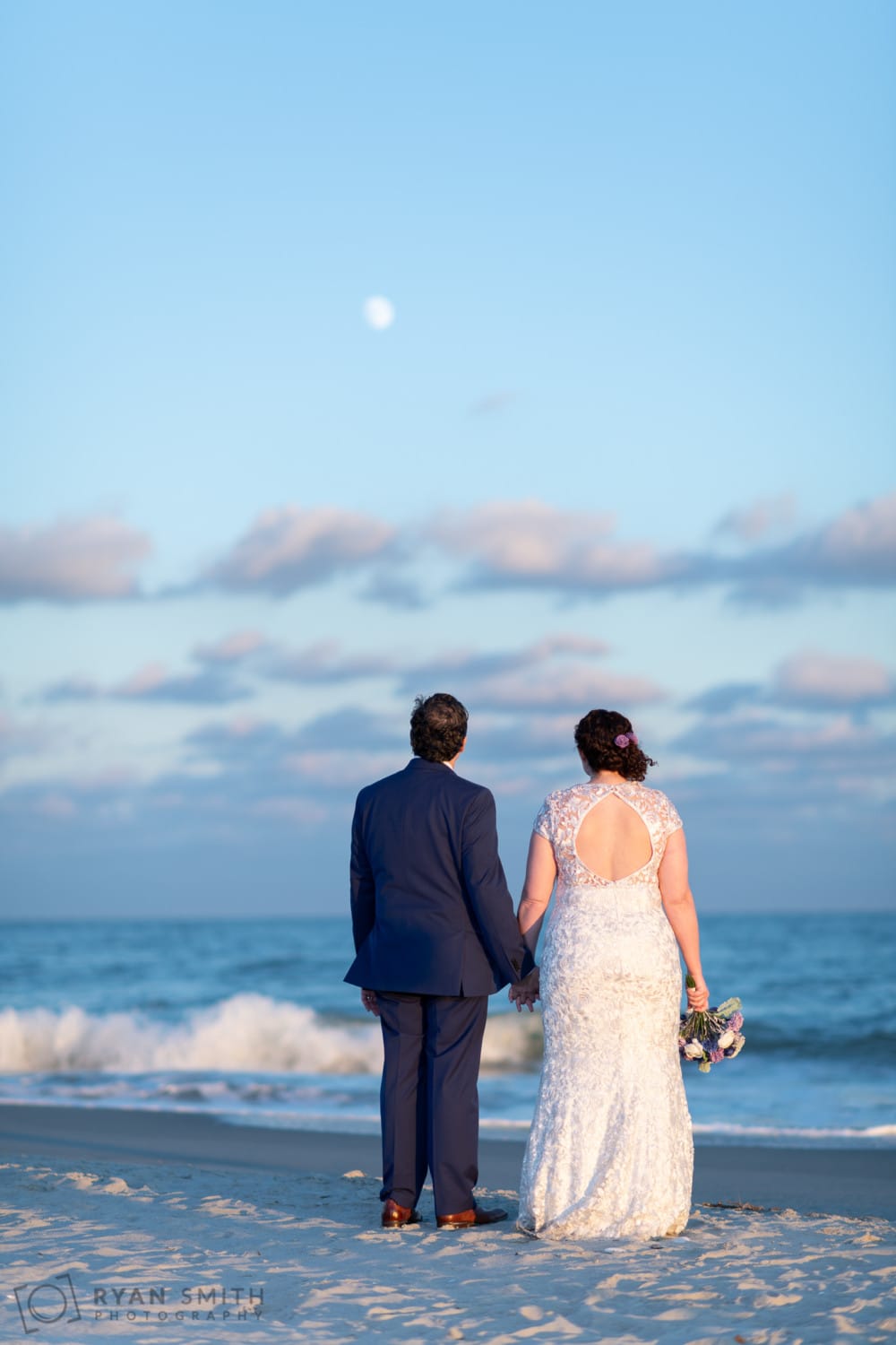 Bride and groom looking at the moon - North Beach Plantation