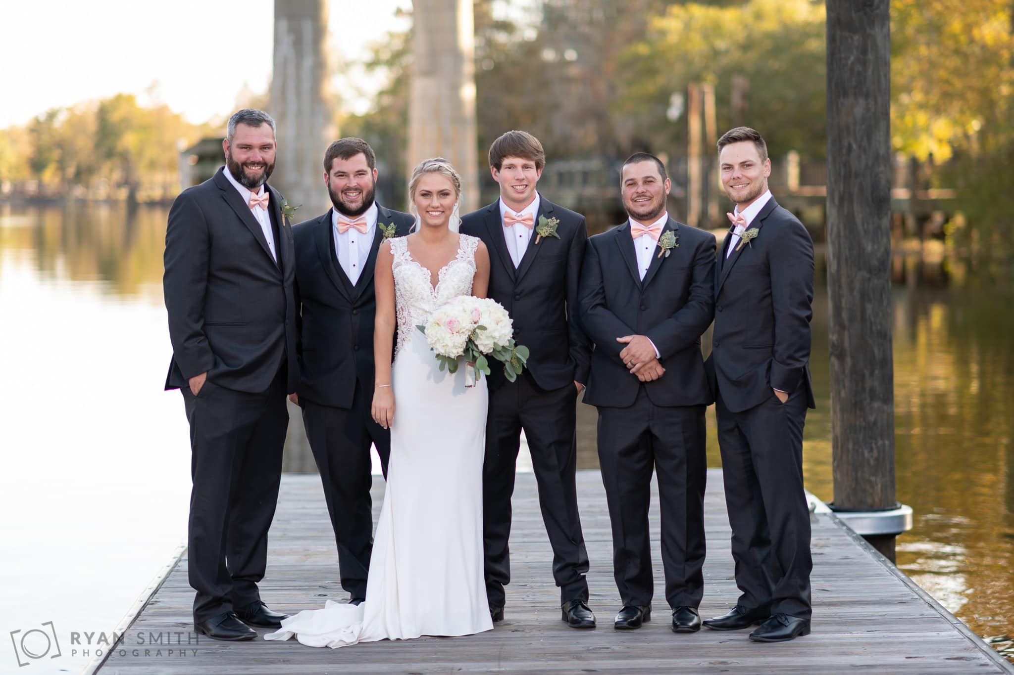 Bride and the groomsmen - Conway River Walk