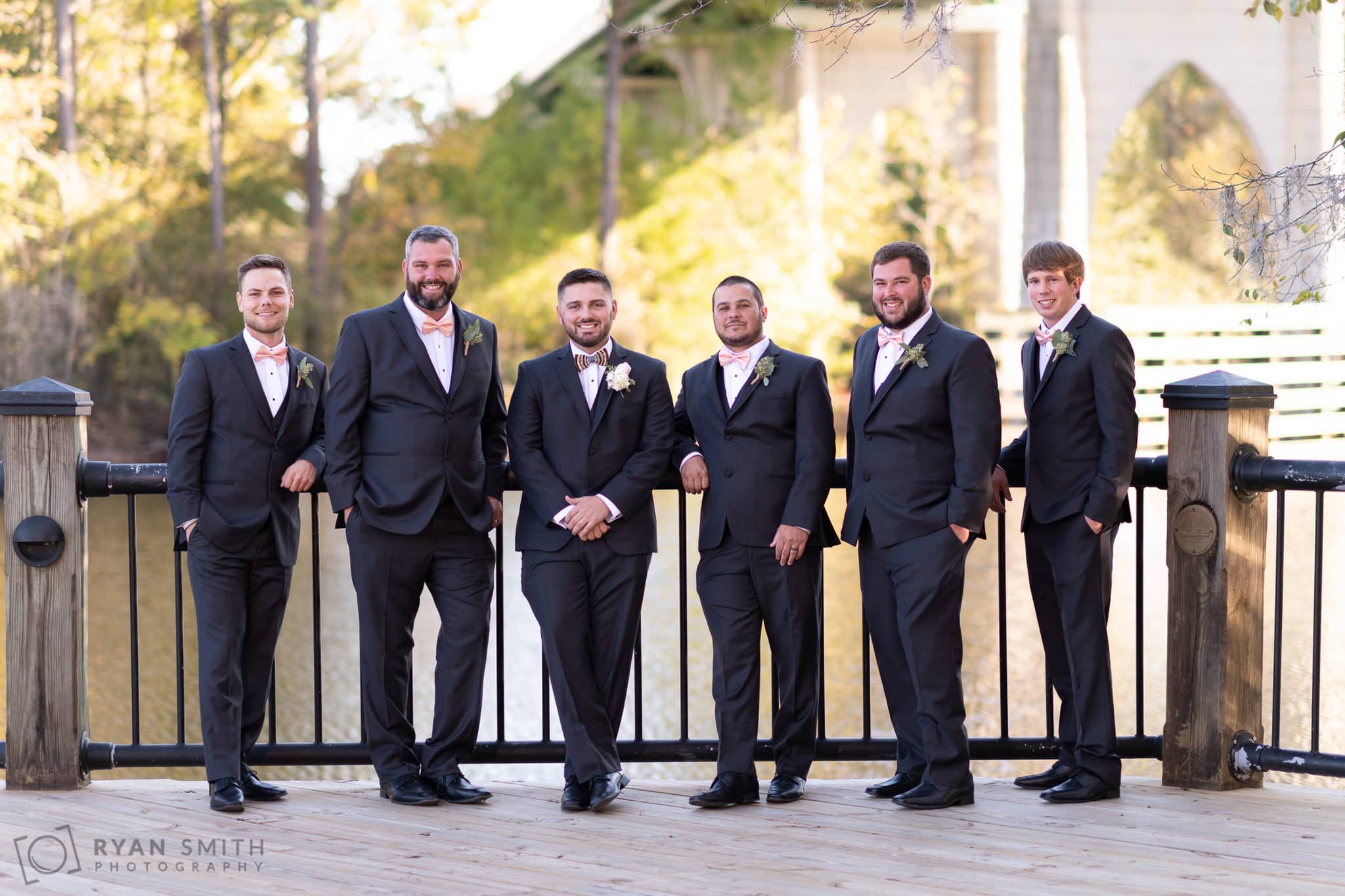 Casual portrait of groomsmen by the river - Conway River Walk