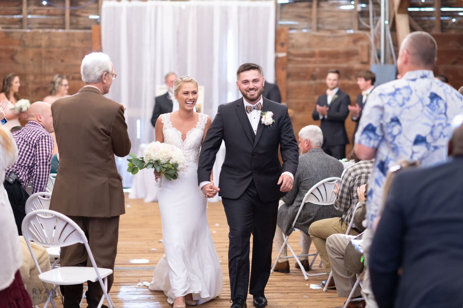 Happy bride and groom leaving the ceremony - Peanut Warehouse - Conway