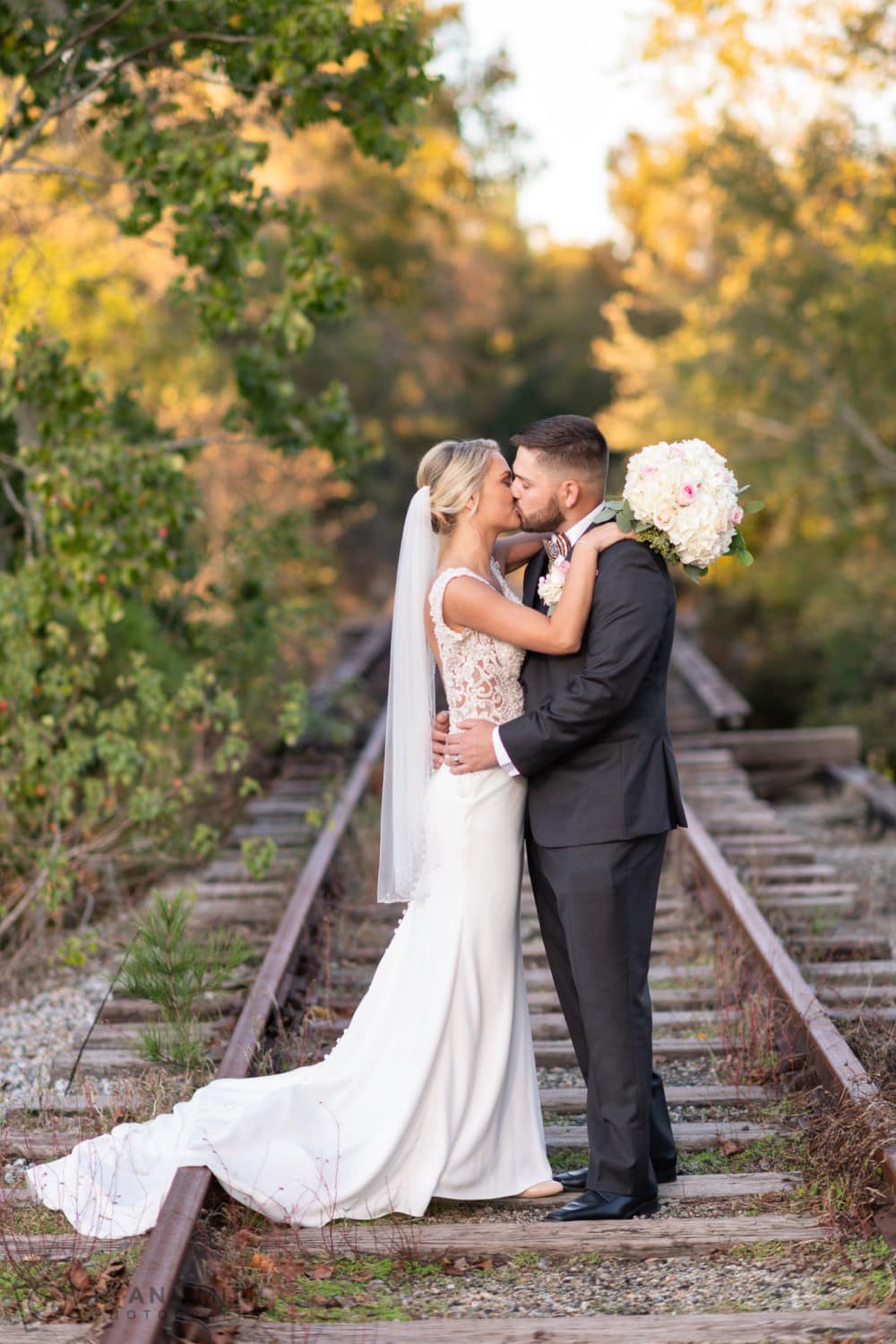 Kiss on the train tracks - Conway River Walk