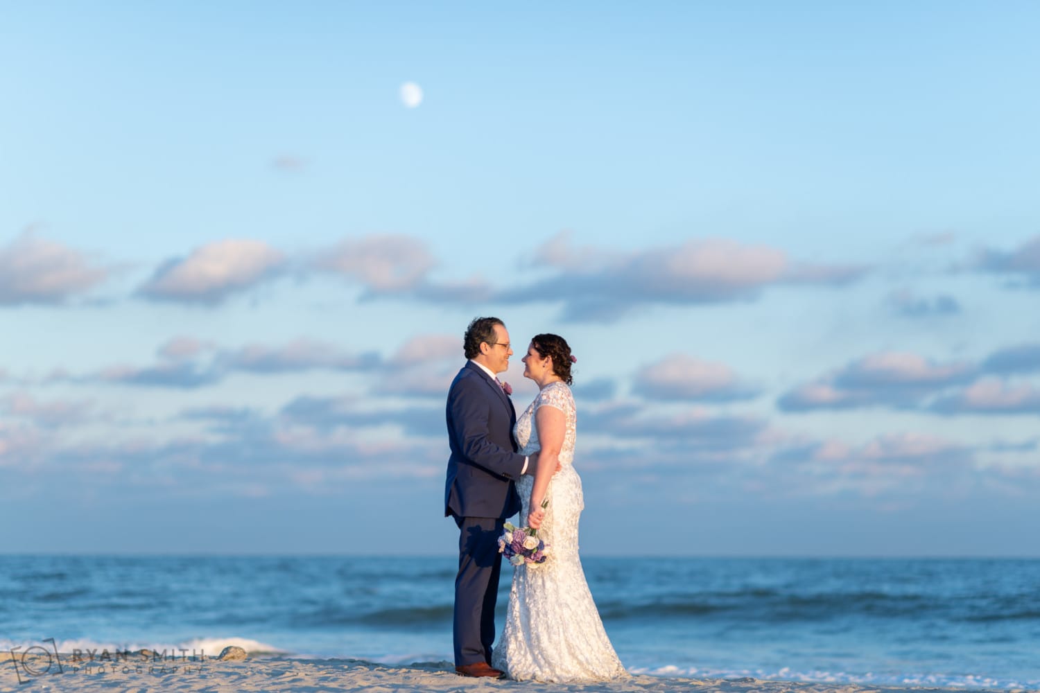 Looking into each other eyes in front of the full moon - North Beach Plantation