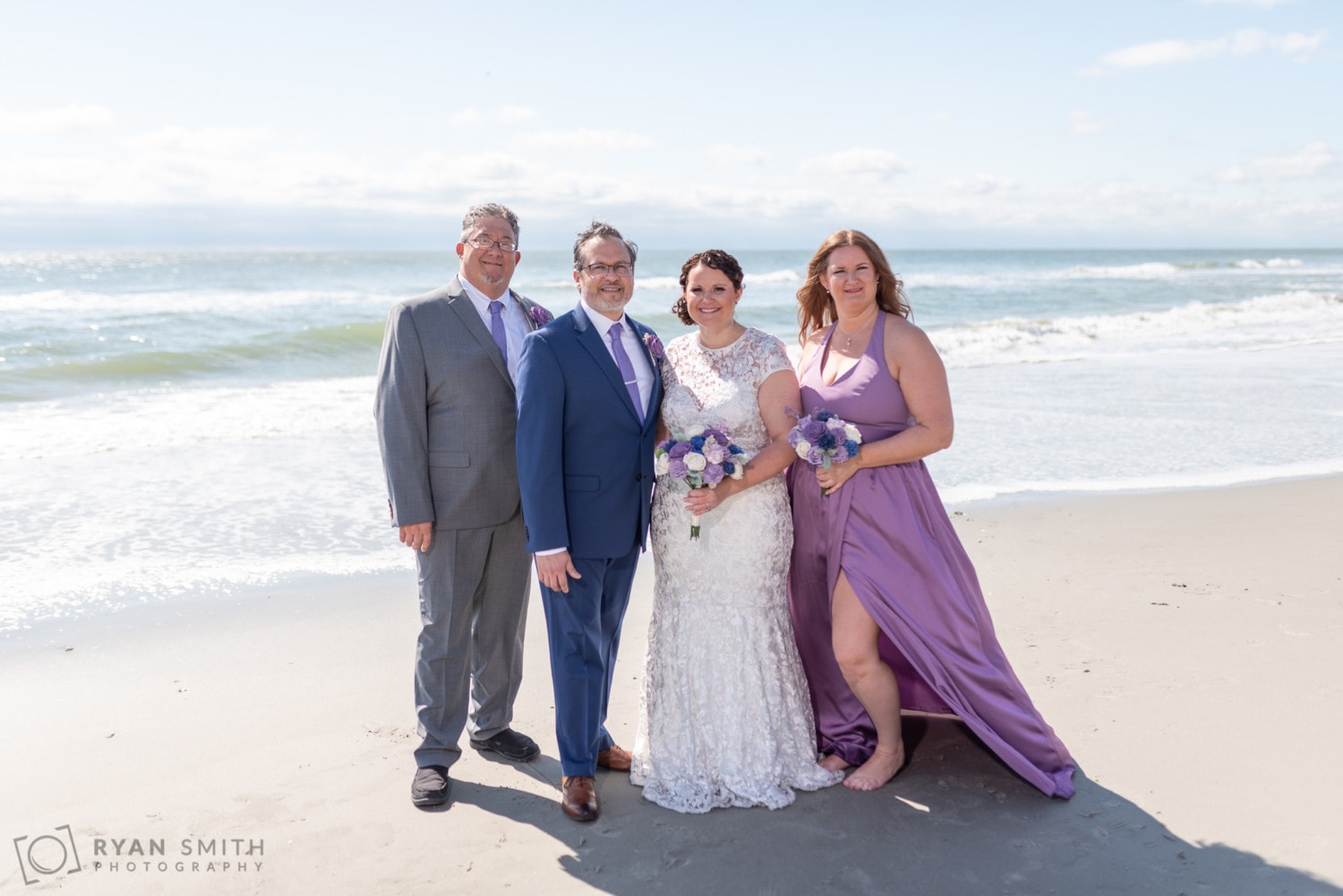 Midday portrait of wedding party on the beach - 21 Main Events