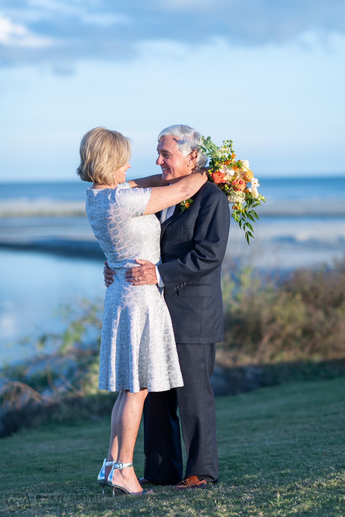 Portrait of bride and groom on the hill by the ocean - Dunes Golf and Beach Club - Myrtle Beach