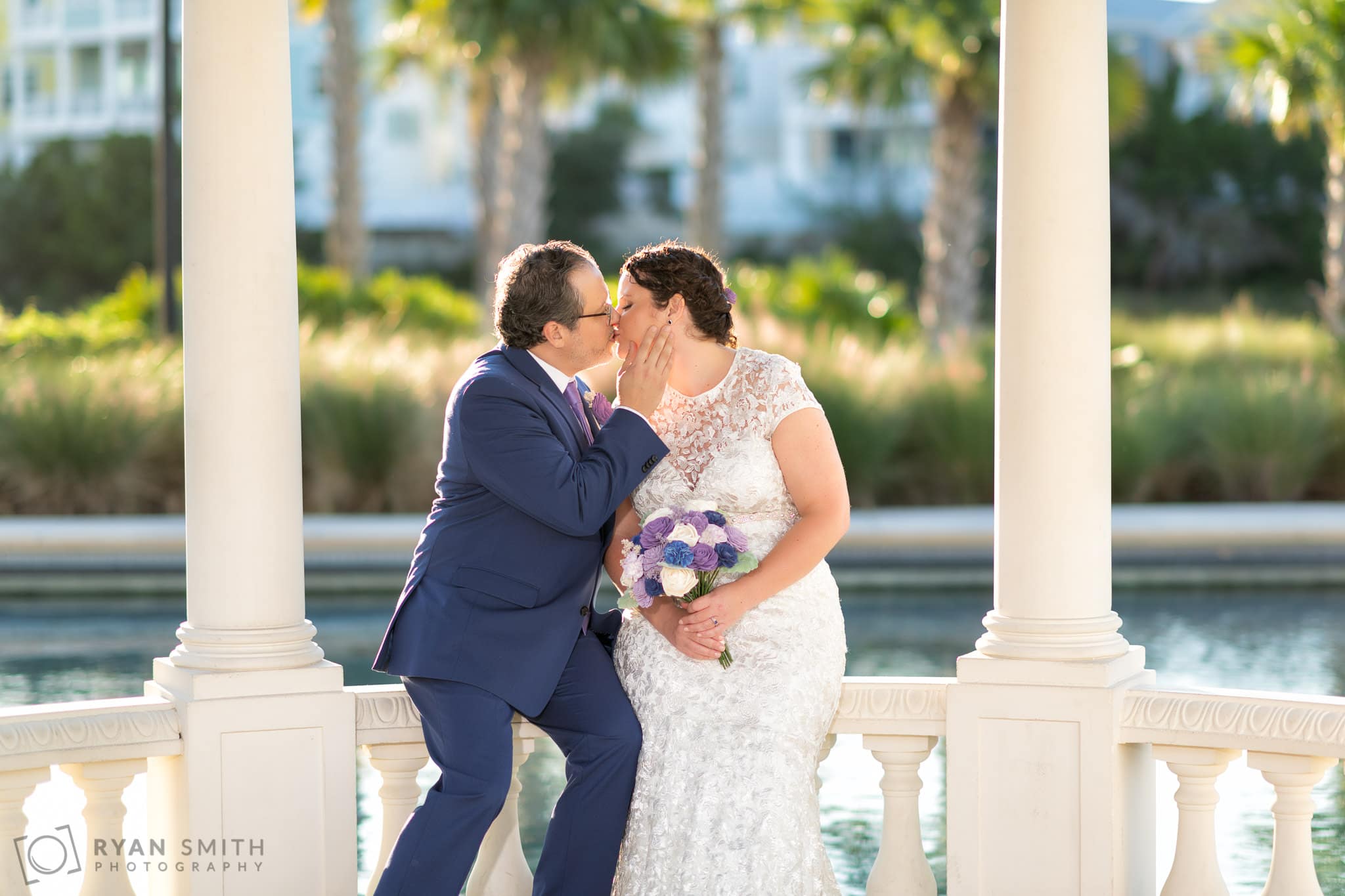 Sitting together and kissing on the gazebo  - North Beach Plantation