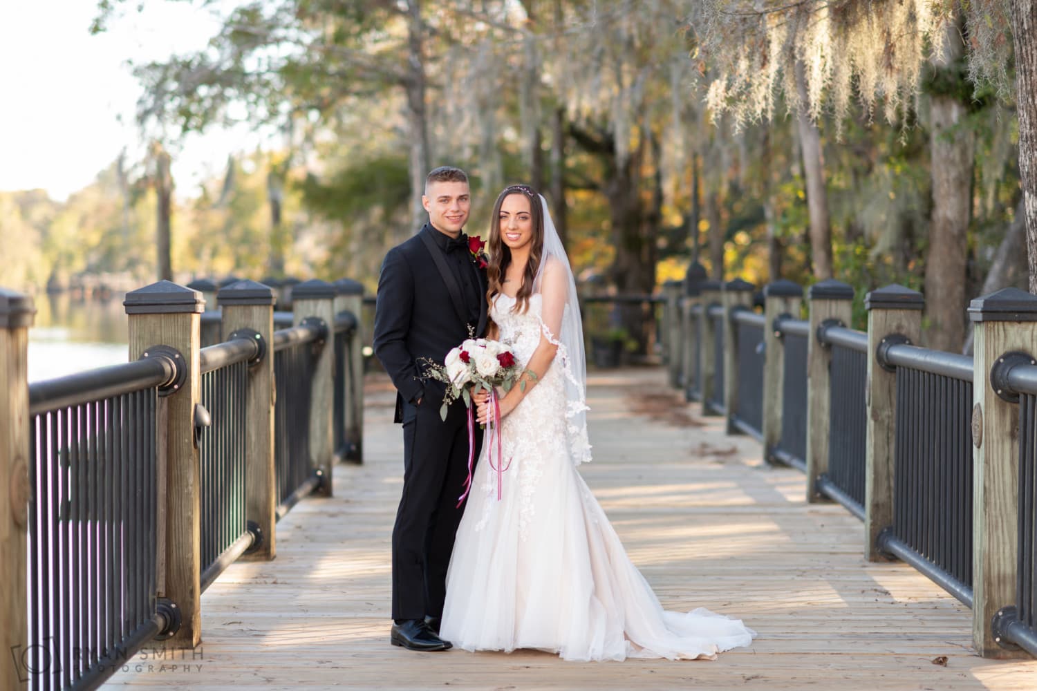 Bride and groom wedding portrait on the boardwalk - Conway River Walk