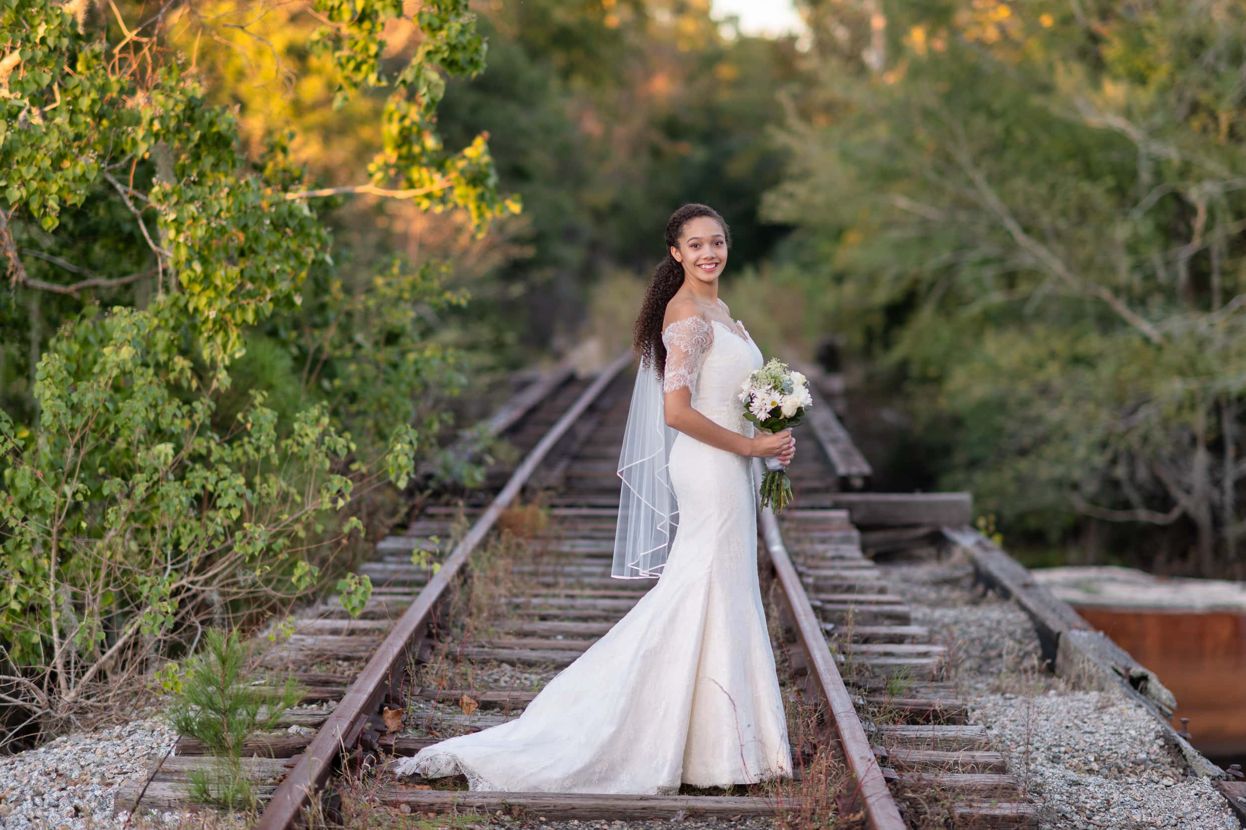 Bride standing on the train tracks - Conway Riverwalk