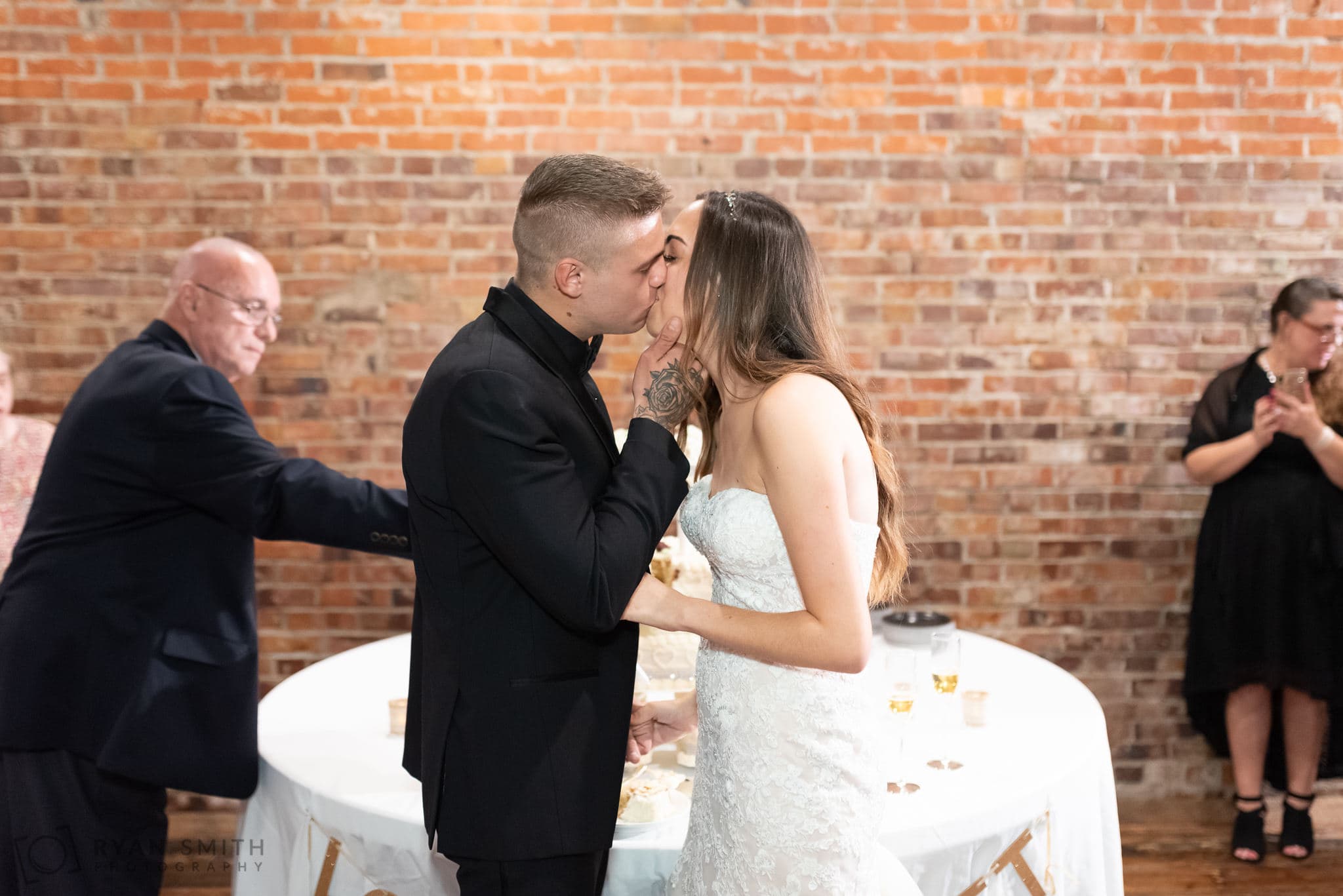 Kiss after cake cutting - 104 Laurel St