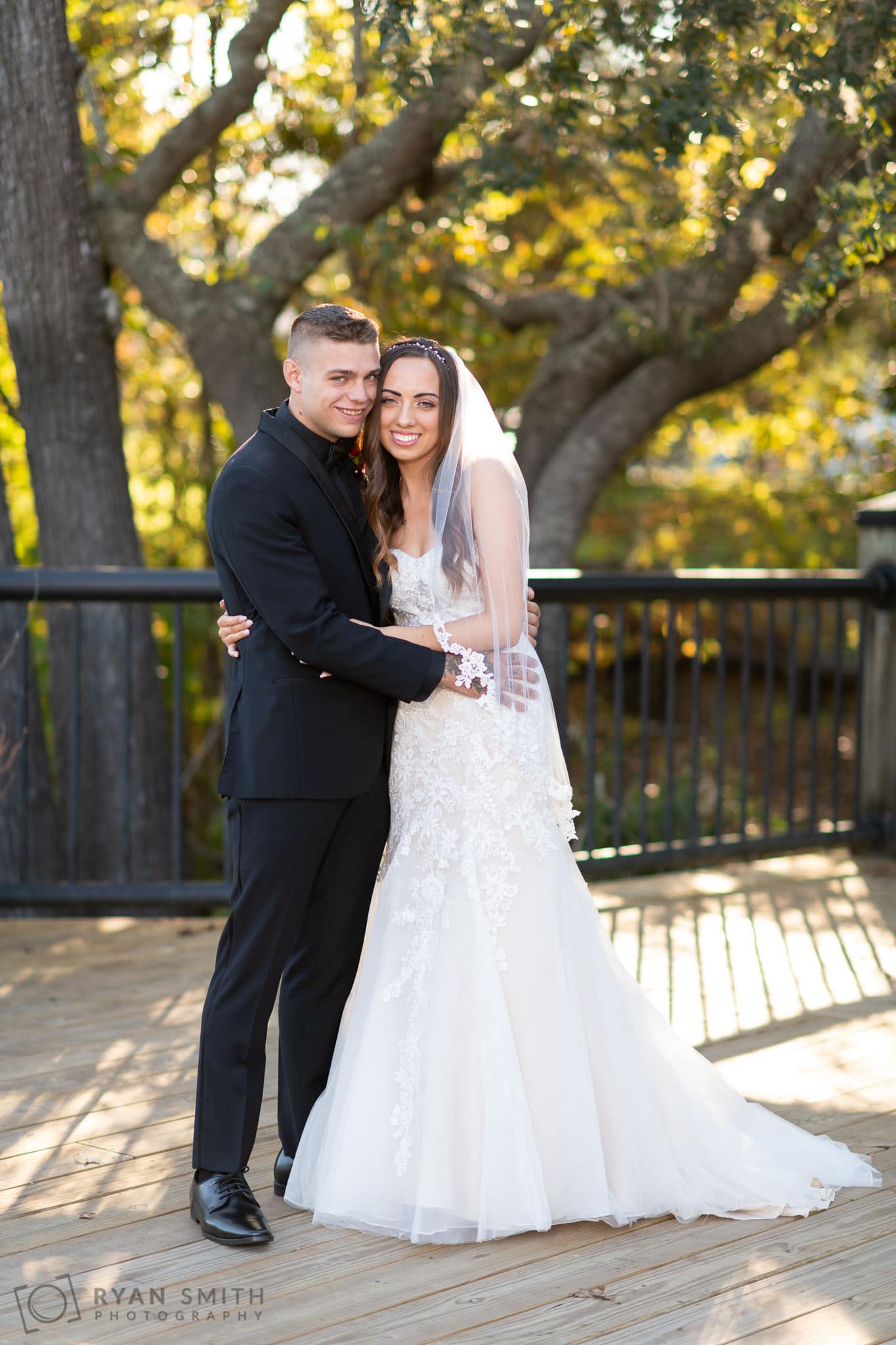Portraits of the bride and groom on the south end of the boardwalk - Conway River Walk