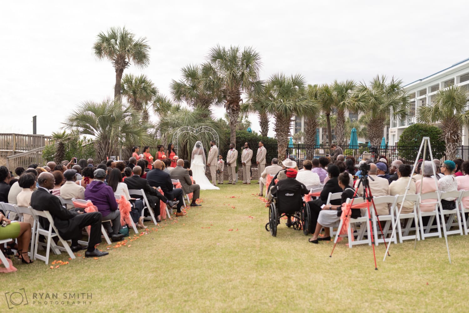 Bride and groom listening to the minister - Doubletree Resort - Myrtle Beach
