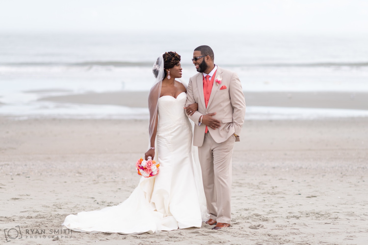 Bride and groom standing in front of the ocean - Doubletree Resort - Myrtle Beach