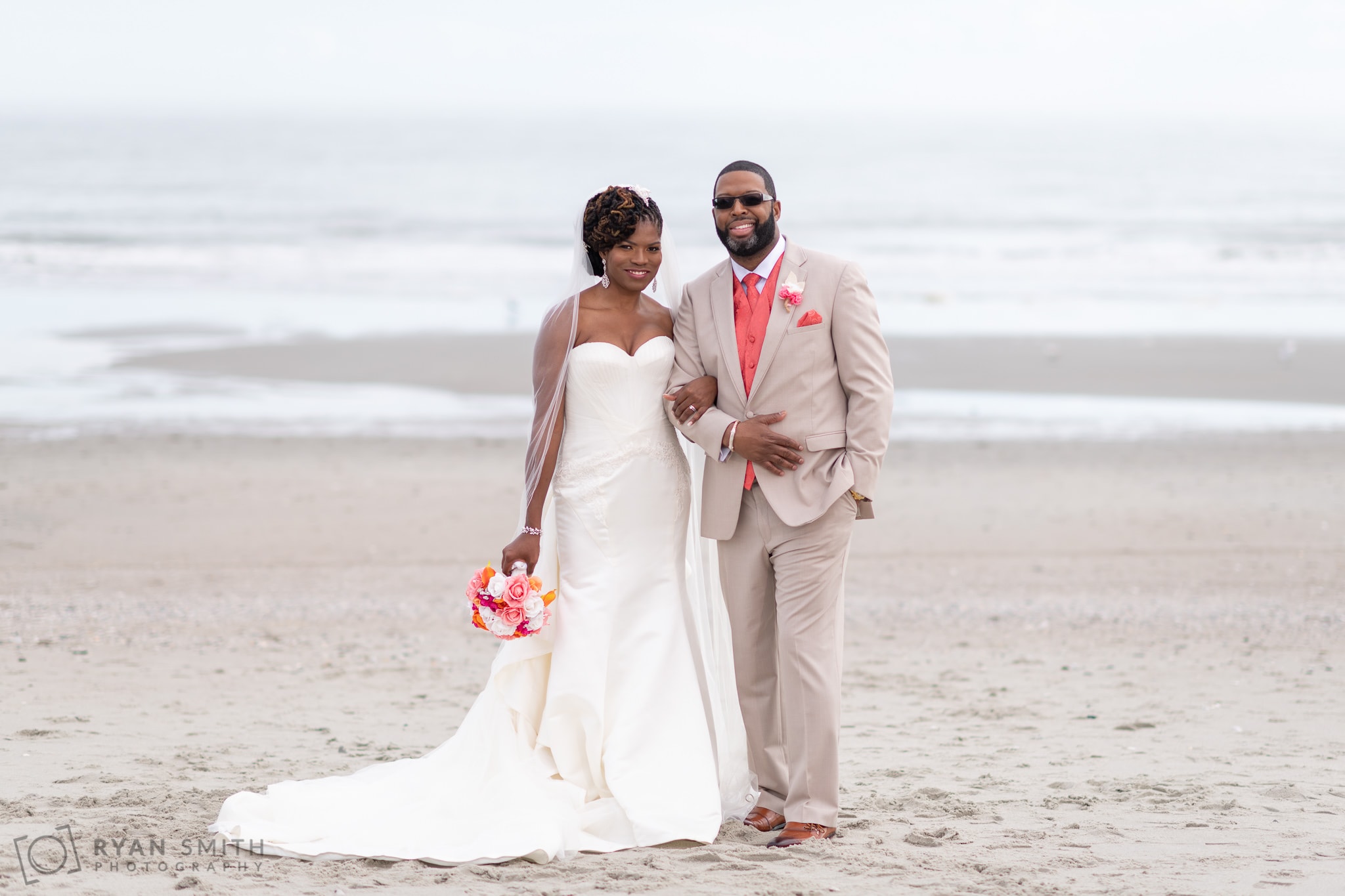 Bride and groom standing in front of the ocean - Doubletree Resort - Myrtle Beach