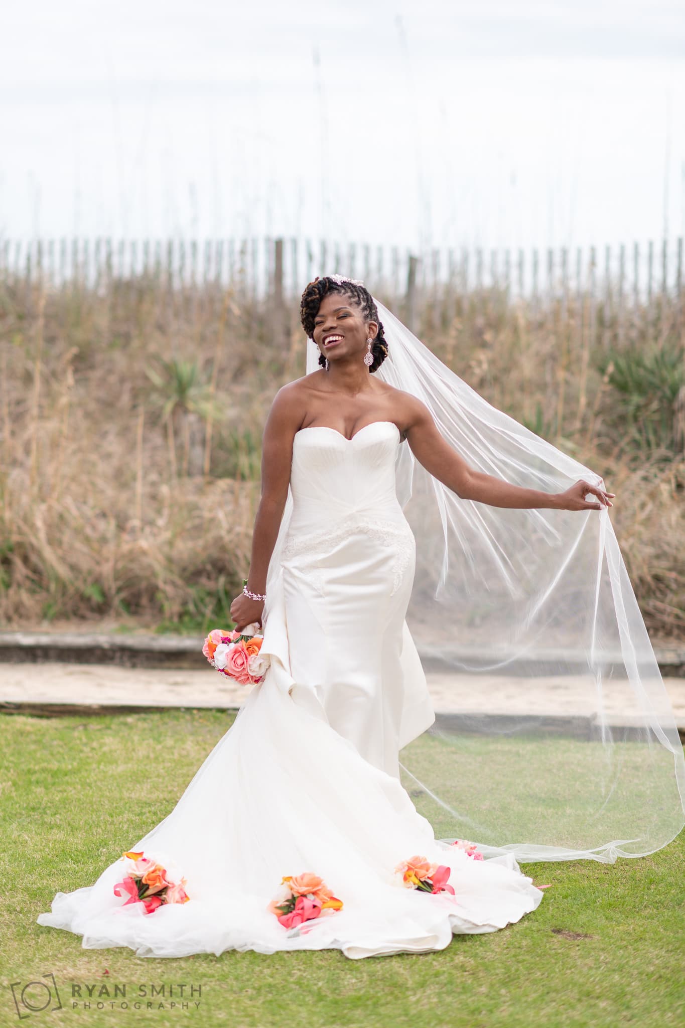 Bride posing with flowers on her dress - Doubletree Resort - Myrtle Beach