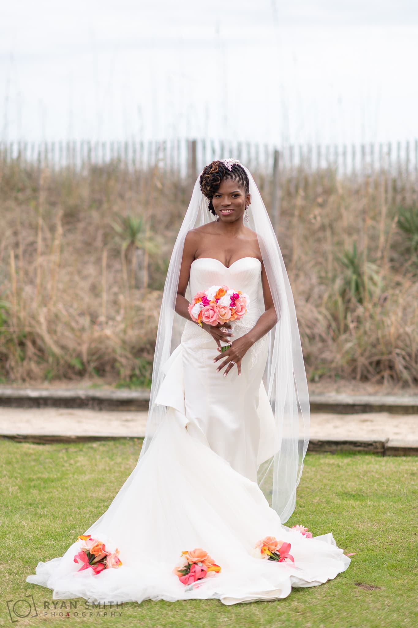 Bride posing with flowers on her dress - Doubletree Resort - Myrtle Beach