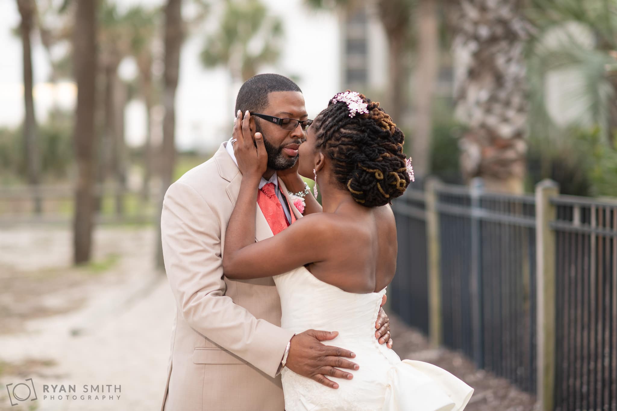 Bride pulling groom in for a kiss - Doubletree Resort - Myrtle Beach