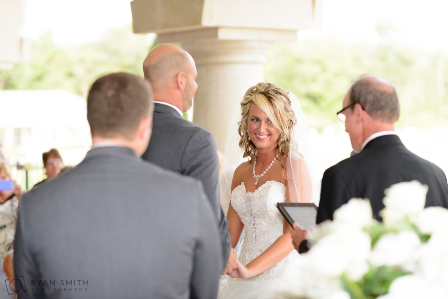 Bride smiling during the ceremony - Members Club at Grande Dunes