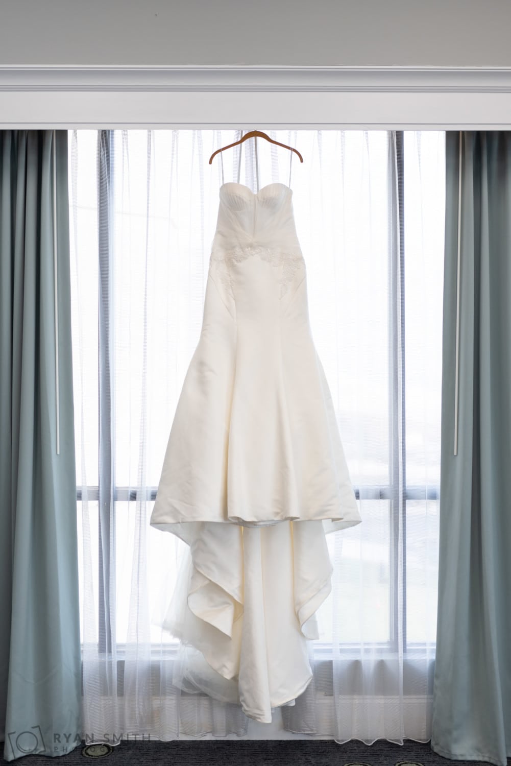 Bride's dress hanging in the window - Doubletree Resort - Myrtle Beach