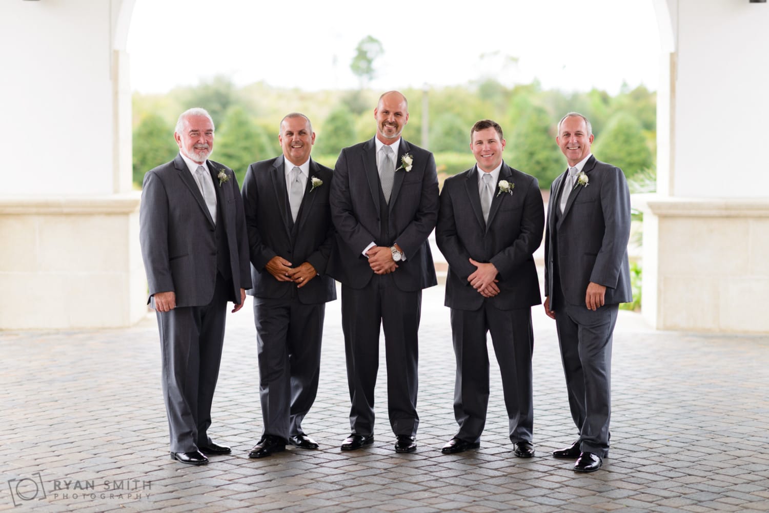 Groomsmen in front of the clubhouse - Members Club at Grande Dunes